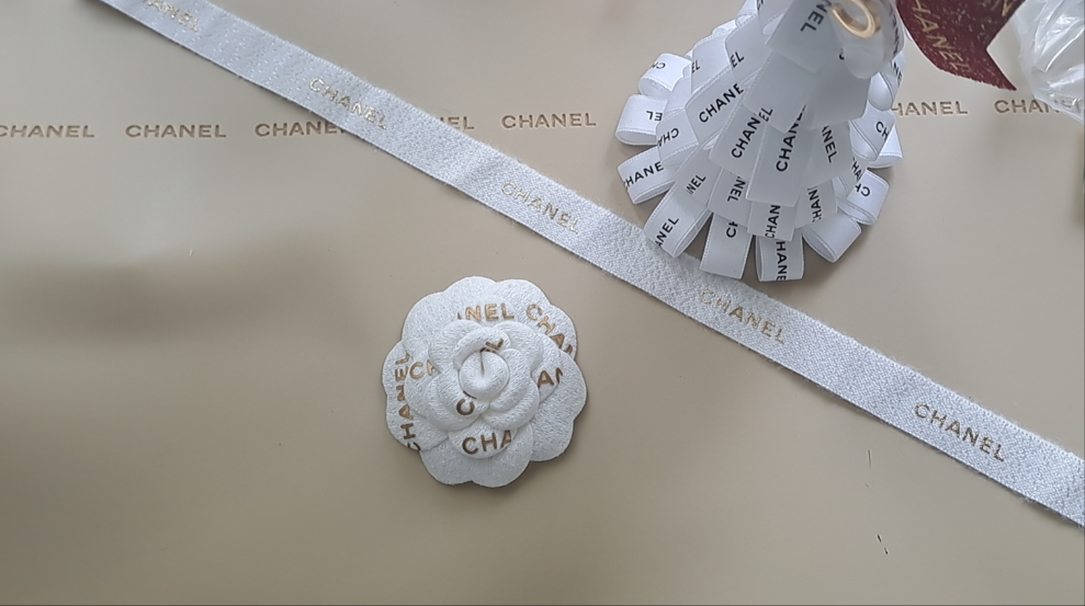 Chanel Holiday white Gold Woven Camellia sticker from Beauty Counter