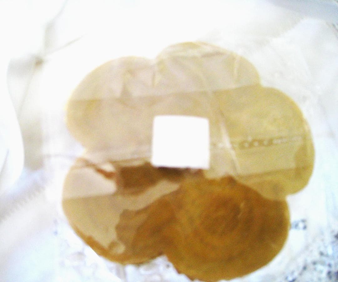Chanel Sequin Gold Camellia sticker from Beauty Counter