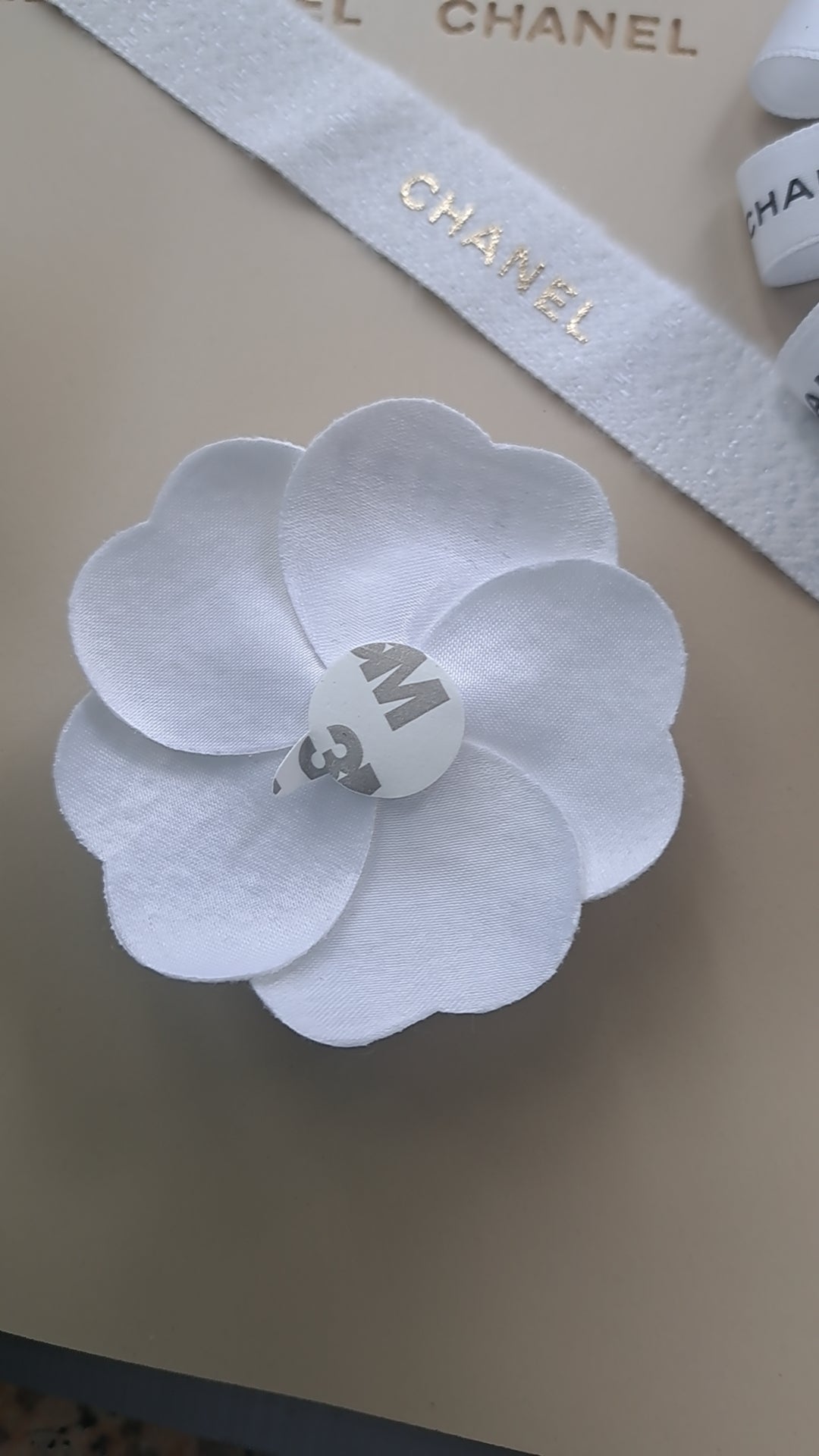 Chanel Holiday white Gold Woven Camellia sticker from Beauty Counter