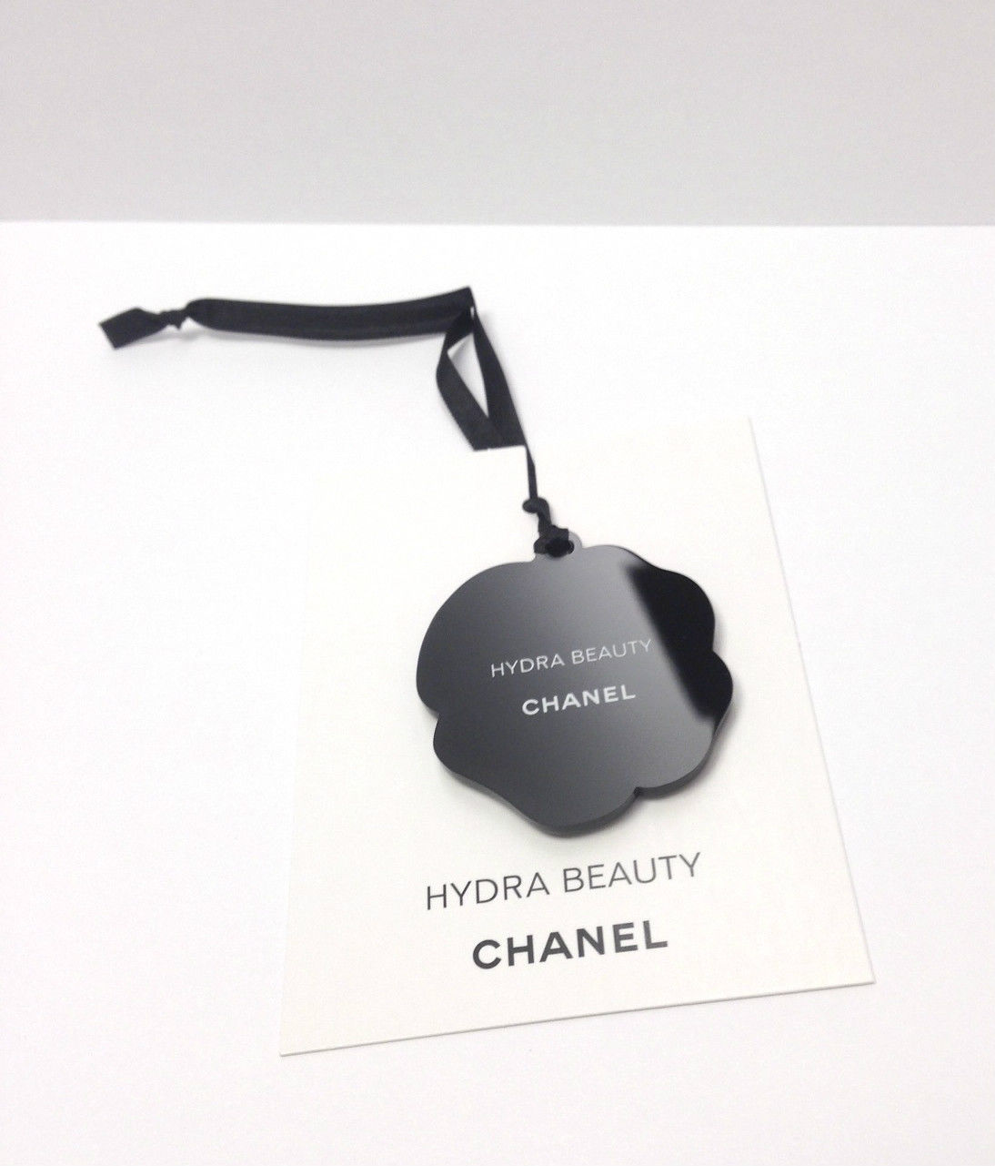 Hydra Beauty camellia light blue charm logo plastic collectable