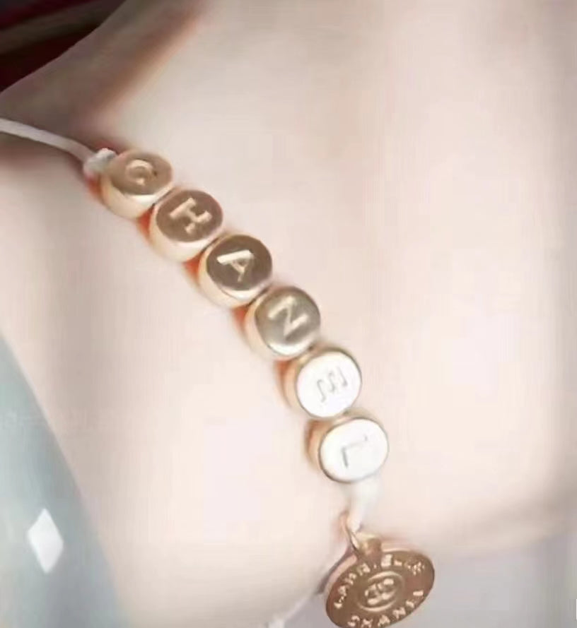 New Chanel Gabrielle gold tone bracelet charm