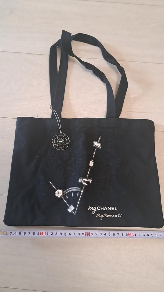 Chanel Luxury Jewelry My Moment tote bag with camellia charm