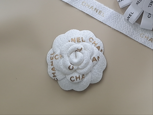 Chanel Holiday white Gold Woven Camellia sticker from Beauty Counter