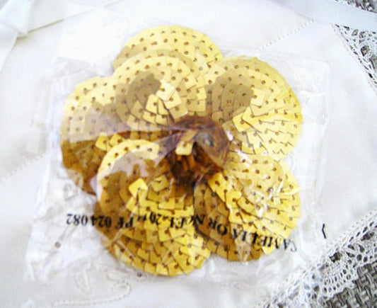 Chanel Sequin Gold Camellia sticker from Beauty Counter