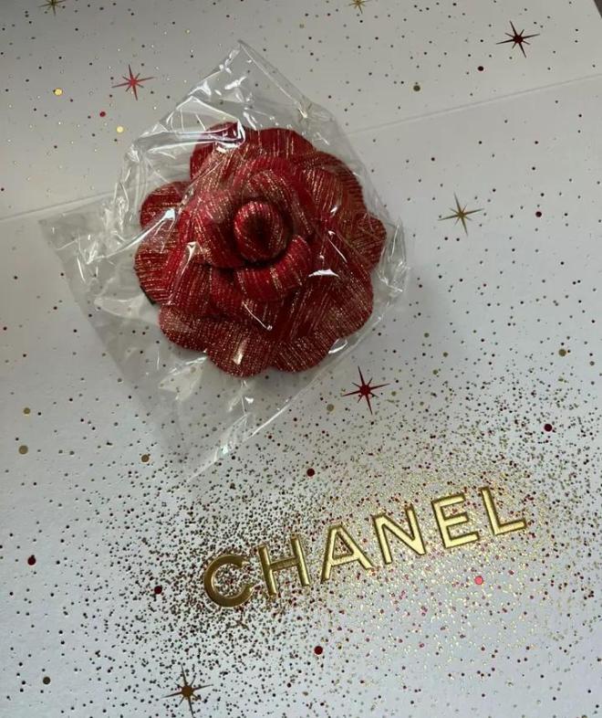 Chanel Holiday Red Gold Woven Camellia sticker from Beauty Counter