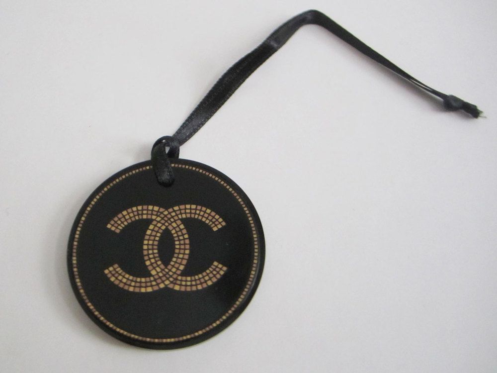 Chanel gold black charm logo plastic collectable