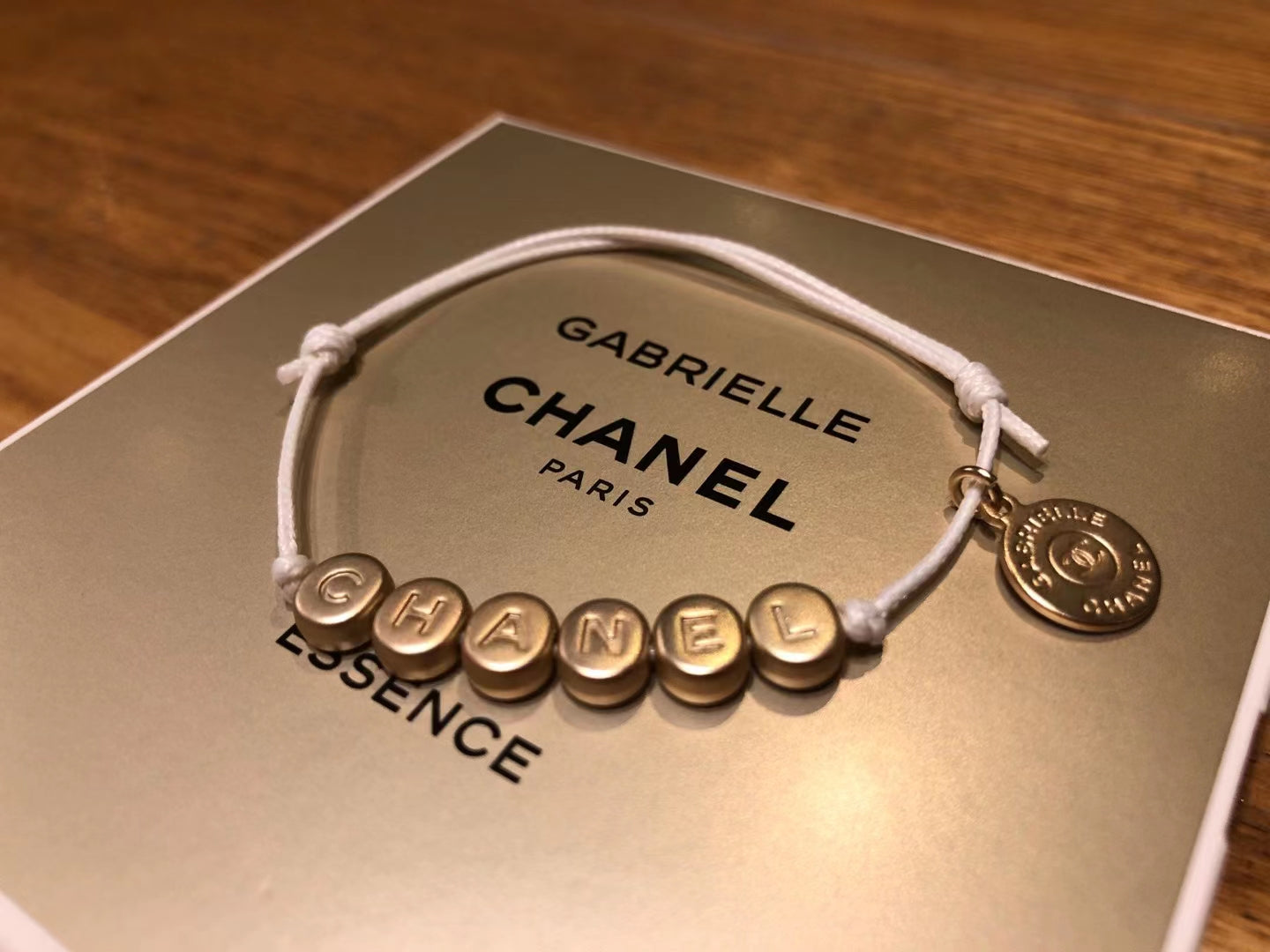 New Chanel Gabrielle gold tone bracelet charm