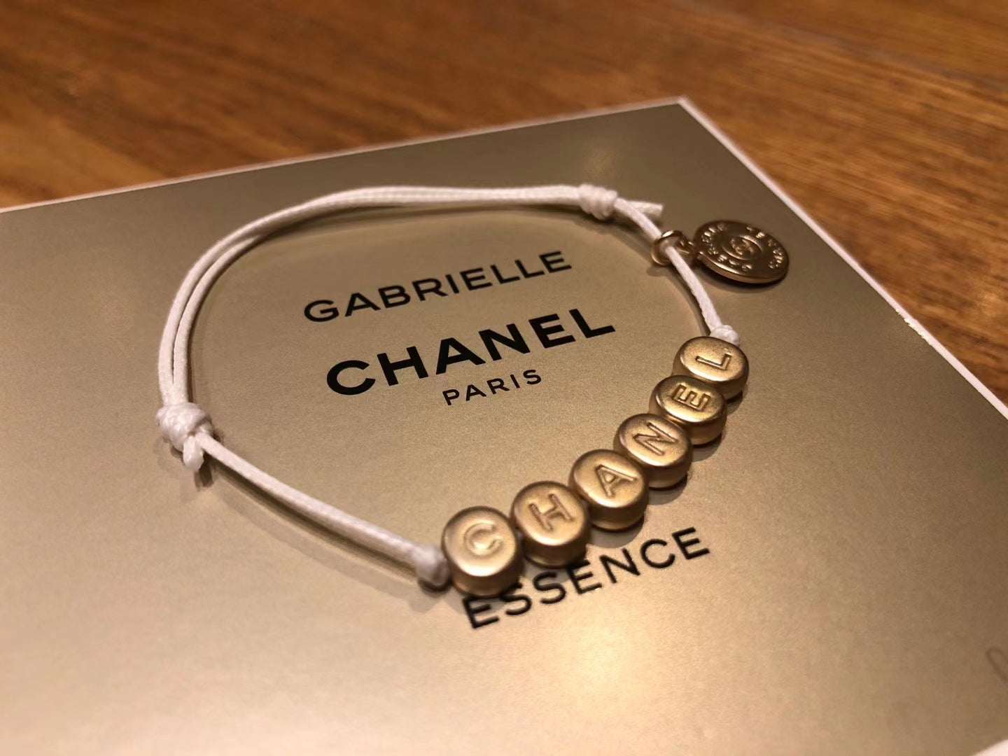 New Chanel Gabrielle gold tone bracelet charm