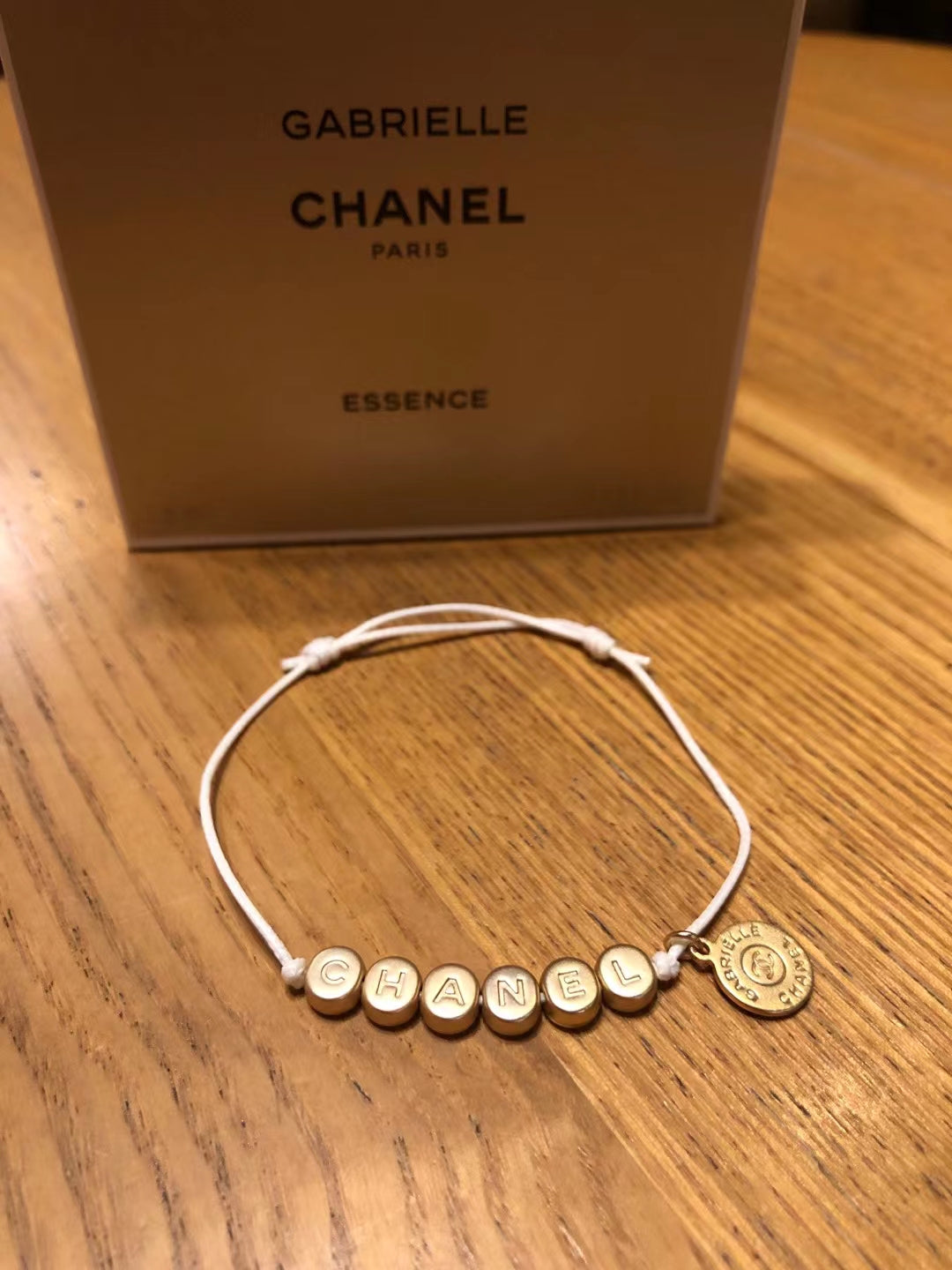 New Chanel Gabrielle gold tone bracelet charm