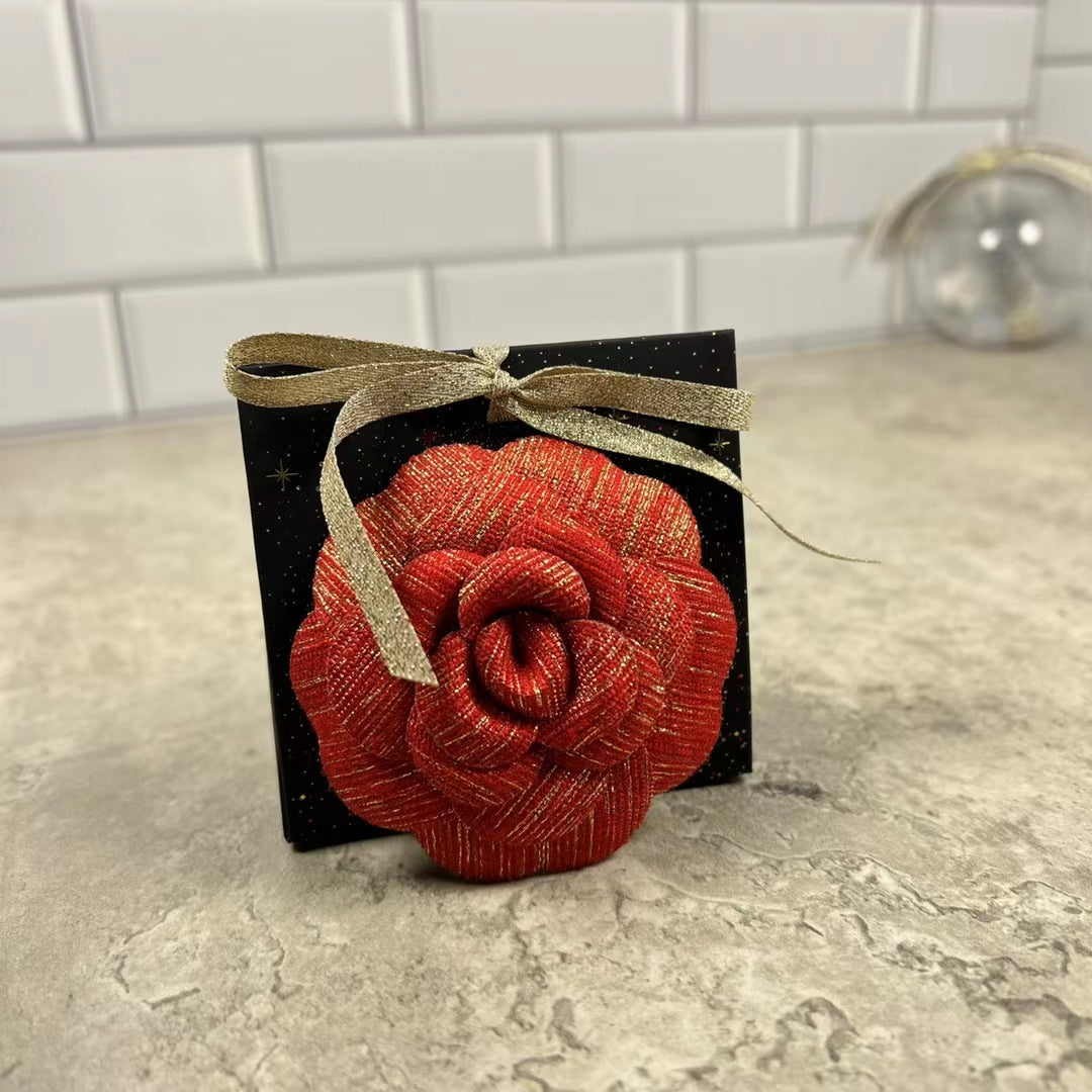 Chanel Holiday Red Gold Woven Camellia sticker from Beauty Counter